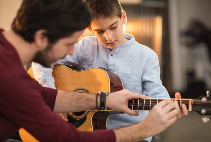 guitar teacher and student